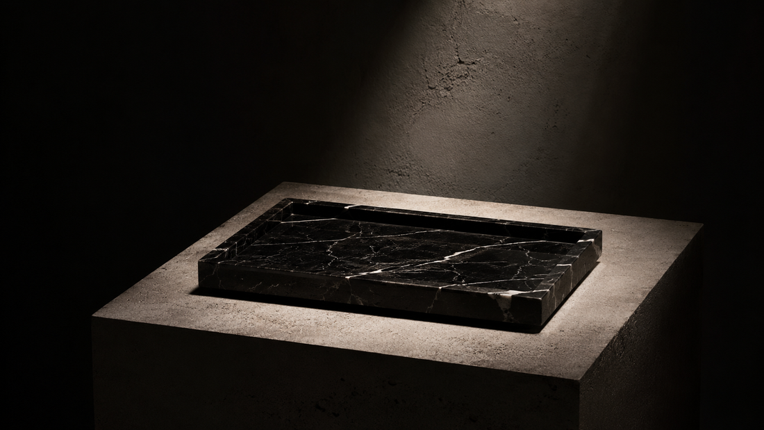 Editorial photograph of a black marble tray displayed as a timeless object under dramatic light, representing slow rituals, quiet luxury and intentional living in the River & Root Journal.