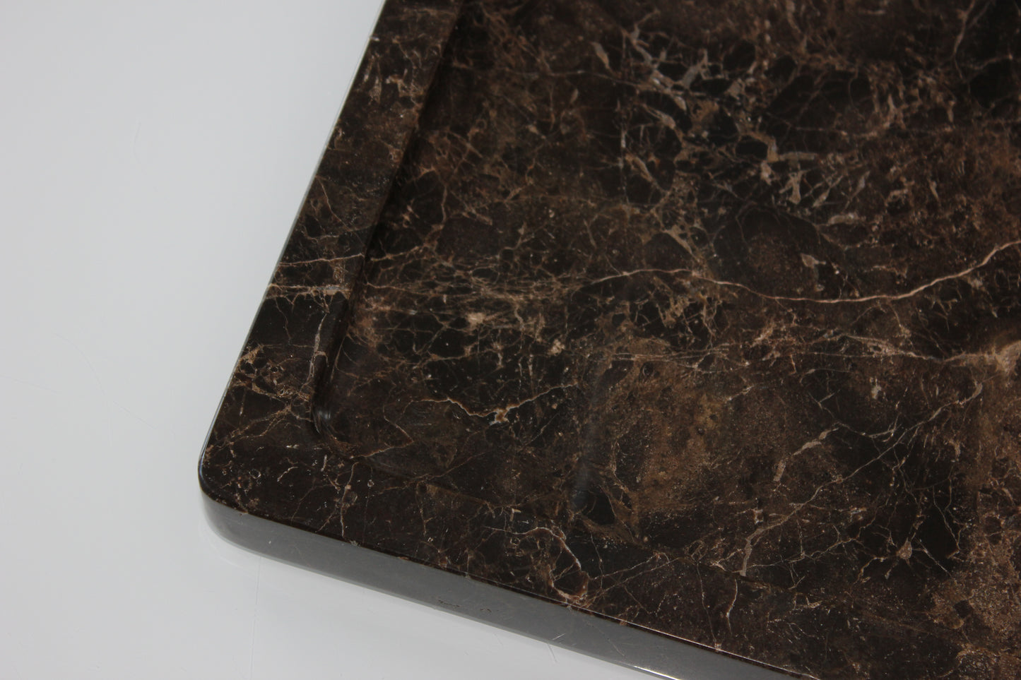 The Monolith tray crafted from natural Dark Emperador marble.