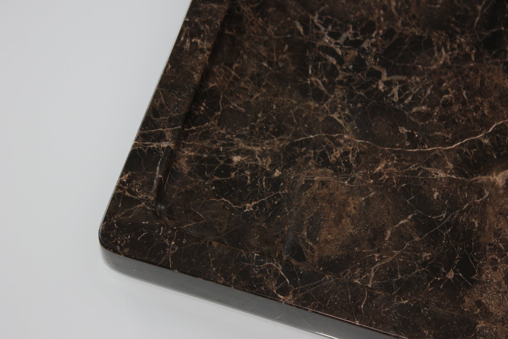 The Monolith tray crafted from natural Dark Emperador marble.